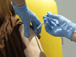 A volunteer participates in the vaccine trial in Oxford, England on July 7, 2020.