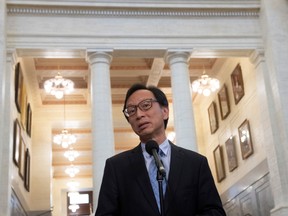 Senator Yuen Pau Woo, facilitator of the Independent Senators Group (ISG) speaks with the media in the foyer of the Senate in Ottawa on Thursday November 28, 2019.