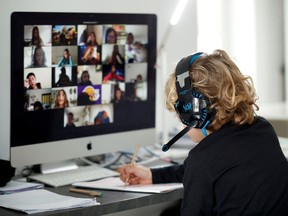 A student takes online classes at home, with his companions, using the Zoom APP during the coronavirus disease (COVID-19) outbreak in El Masnou, north of Barcelona, Spain April 2, 2020.