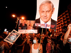 Protesters chant slogans during a demonstration against the Israeli government near the prime minister's residence in Jerusalem on Aug. 2.