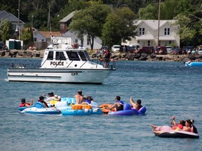 The Ontario Provincial Police keeps watch north of the Blue Water Bridge as floaters in the Float Down make their way down the St. Clair River.
