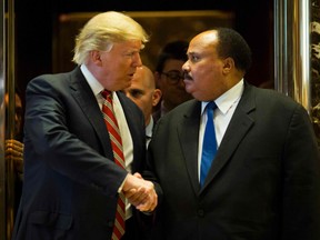 Then-U.S. President-elect Donald Trump shakes hands with Martin Luther King III after meeting at Trump Tower in New York City on January 16, 2017.