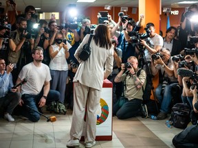 Presidential candidate Svetlana Tikhanovskaya voting at a polling place in Minsk, Belarus on August 9. President Alexander Lukashenko is seeking to extend his 26-year rule amid a wave of public protests.