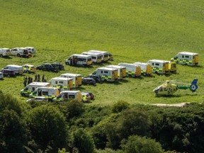 Emergency response vehicles are parked near the scene of a train crash by Stonehaven in northeast Scotland on August 12, 2020.