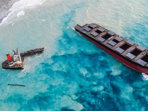 An aerial view taken in Mauritius on August 17, 2020, shows the MV Wakashio bulk carrier, belonging to a Japanese company but Panamanian-flagged, that had run aground and broke into two parts near Blue Bay Marine Park.