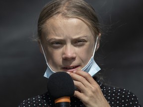 Swedish climate activist Greta Thunberg speaks a press conference after the meeting with German Chancellor Angela Merkel