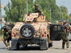 Afghan soldiers arrives with their Humvee vehicle outside a prison during an ongoing raid in Jalalabad on August 3, 2020.
