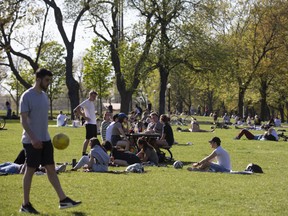 People gather at a park in Montreal, Quebec, Canada, on Wednesday, May 20, 2020.