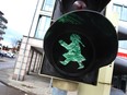 A traffic light, designed as female counterpart to the male figure in Sonthofen, southwestern Germany.