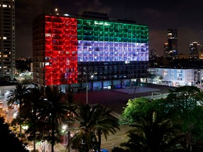 Tel Aviv city hall is lit up in the colours of the United Arab Emirates flag on Aug.13, after Israel and the U.A.E. agreed to normalize relations in a landmark U.S.-brokered deal.