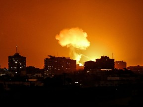 Smoke and flames rise after war planes belonging to the Israeli army carried out airstrikes over Gaza City on August 18, 2020