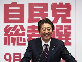 Photo shows Japans Prime Minister Shinzo Abe attending a press conference after winning the ruling liberal Democratic Party's (LDP) leadership election at the party's headquarters in 2018
