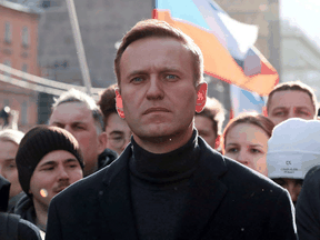 Russian opposition politician Alexei Navalny takes part in a rally to mark the 5th anniversary of opposition politician Boris Nemtsov's murder and to protest against proposed amendments to the country's constitution, in Moscow, Russia February 29, 2020.