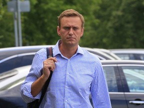 Russian opposition leader Alexei Navalny walks before a court hearing in Moscow, Russia July 1, 2019.