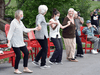 People dance as musicians entertain Bobcaygeon locals from a safe distance.