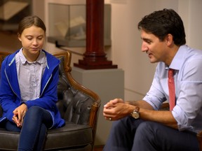 Prime Minister Justin Trudeau, right, sits down with Swedish climate change activist Greta Thunberg, in Montreal, in 2019.