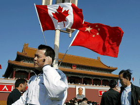Flags of Canada and China in front of Tiananmen Gate in Beijing.