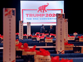 Delegates talk prior to the start of the first day of the Republican National Convention on August 24, 2020, in Charlotte, North Carolina.