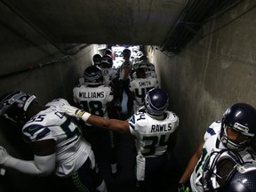 The Seattle Seahawks wait in the tunnel to take the field for a game with the San Diego Chargers in 2015. One of the team's players was ousted this week after going against league protocol and attempting to sneak a woman into the team hotel.
