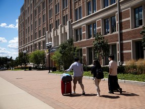 Students move back into the dorm for fall semester at the University of Michigan campus, amid COVID-19 outbreak