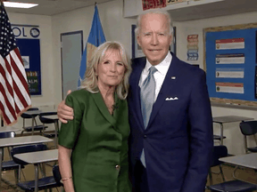 Democratic presidential nominee Joe Biden joins his wife Jill Biden in a classroom after she addressed the virtual 2020 Democratic National Convention on August 18, 2020.