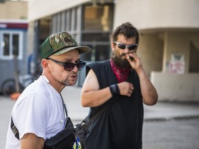 KT (front), a resident and Zachary Bulkowski, who is homeless (not a resident) outside of the City of Toronto temporary shelter at the Roehampton Hotel, on Mt.Pleasant Rd. at Eglinton Ave E., in Toronto, Ont. on Wednesday August 12, 2020.