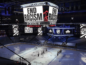An End Racism message is displayed before the start of the NHL playoff game between the Boston Bruins and Tampa Bay Lightning in Toronto, Wednesday, Aug. 26, 2020.