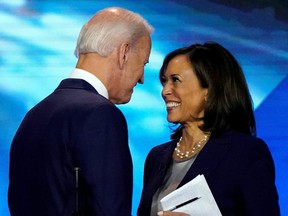 Former Vice President Joe Biden talks with Senator Kamala Harris after the conclusion of the 2020 Democratic U.S. presidential debate in Houston, Texas, U.S., September 12, 2019.