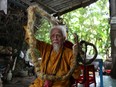 Nguyen Van Chien, 92, shows off his five-meter-long hair at his home in Tien Giang province, Vietnam, August 21, 2020. Picture taken August 21, 2020.