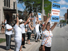 People demanding Windsor and Essex County move to Stage 2, protest outside the Windsor-Essex County Health Unit, June 24, 2020. Now the county is one of the few in Canada still at Stage 2.