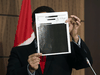 Conservative MP Pierre Poilievre holds up redacted documents related to the WE scandal, tabled at the House of Commons finance committee by the Liberal government, Wednesday, Aug. 19, 2020.
