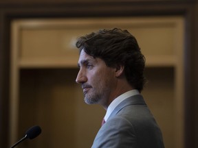 Prime Minister Justin Trudeau listens to a question during a news conference on parliament hill in Ottawa, Tuesday, Aug. 18, 2020.