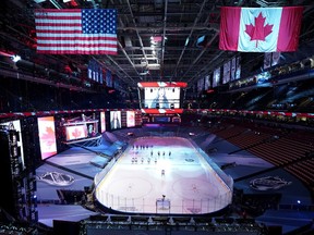 The Columbus Blue Jackets and the Toronto Maple Leafs stand on the ice for the Canadian national anthem before Game One of the Eastern Conference Qualification Round prior to the 2020 NHL Stanley Cup Playoffs at Scotiabank Arena on August 02, 2020 in Toronto, Ontario, Canada.