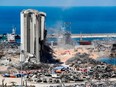 Diggers remove earth at the blast site next to the silos at the port of Beirut on Aug. 16, 2020, in the aftermath of the massive explosion there that ravaged Lebanon's capital.