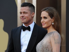 This file photo taken on March 2, 2014 shows actors Brad Pitt and Angelina Jolie arriving on the red carpet for the 86th Academy Awards in Hollywood, California.