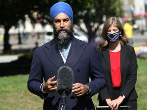 NDP Leader Jagmeet Singh is joined by NDP MP Laurel Collins to announce that the New Democrats are looking to build a better Canada with a universal child care program during a press conference on the front lawn of the B.C. Legislature in Victoria, B.C., on Friday August 14, 2020.
