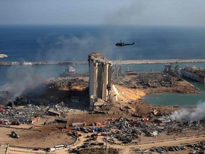 general view shows the damaged grain silos of Beirut's harbour and its surroundings on August 5, 2020, one day after a powerful twin explosion tore through Lebanon's capital, resulting from the ignition of a huge depot of ammonium nitrate at the city's main port.