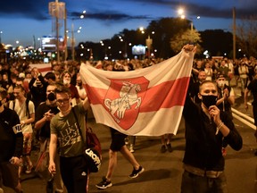 Opposition supporters protest after polls closed in Belarus' presidential election, in Minsk on August 9, 2020.