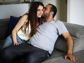 Emmanuelle Lteif Khnaisser, who was in labour at the moment of the Beirut port blast, is kissed by her husband Edmond Khnaisser at their family home in Jal el-Dib, Lebanon, August 12, 2020.