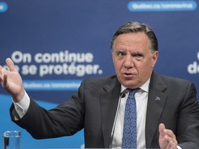 Quebec is reporting 108 additional cases of COVID-19 in the past 24 hours -- the lowest daily number since mid-July. Quebec Premier Francois Legault speaks during a news conference in Montreal, Monday, July 13, 2020.