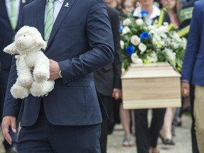 An investigation by Quebec's human rights commission into the death of a seven-year-old girl in Granby, Que., has identified failures at all stages of the clinical and legal process designed to protect her. The casket of a seven-year-old girl who was found in critical condition inside of a home and later died is carried from the church after funeral services, in Granby, Que., Thursday, May 9, 2019.