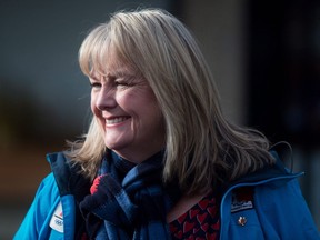 South Surrey-White Rock Conservative byelection candidate Kerry-Lynne Findlay smiles while campaigning with then-Conservative Leader Andrew Scheer, not shown, in Surrey, B.C., Monday, Dec. 4, 2017. Findlay, a Conservative MP, is apologizing for "thoughtlessly" retweeting an anti-Semitic post by a conspiracy theorist in an attempt to criticize Finance Minister Chrystia Freeland.