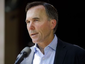 Canada's official fiscal watchdog says the federal wage subsidy program may cost more than $14 billion less than what the government estimated. Canada's Minister of Finance Bill Morneau speaks to media during a press conference in Toronto, Friday, July 17, 2020.