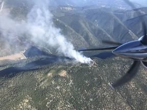 The BC Wildfire Service says crews are tackling a ground fire outside of Lillooet, B.C., that they suspect was human caused, adding to dozens of blazes sparked by recent thunderstorms. Smoke rises from a ground fire near Lillooet, B.C., in an undated handout photo published to social media.