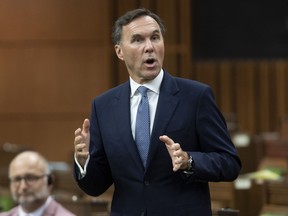 Prime Minister Justin Trudeau says he has full confidence in Finance Minister Bill Morneau and any reports to the contrary are false. Finance Minister Bill Morneau rises during Question Period in the House of Commons in Ottawa, Monday, July 20, 2020.