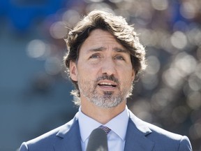 Prime Minister Justin Trudeau speaks to reporters during a news conference following a visit to the National Research Council of Canada (NRC) Royalmount Human Health Therapeutics Research Centre facility in Montreal, Monday, Aug 31, 2020.