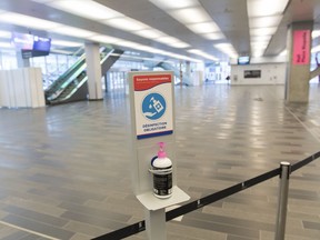 A hand sanitizing dispenser is shown in the Palais des congres in Montreal, Sunday, August 2, 2020, as the COVID-19 pandemic continues in Canada and around the world. The Quebec government has made the wearing of masks and face coverings mandatory in all public spaces as of July 18 and will increase the number of indoor and outdoor group gatherings to 250 people as of August 3rd.