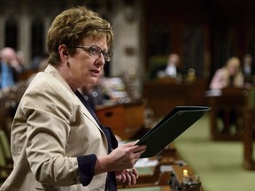 Conservative MP Diane Finley stands during question period in the House of Commons on Parliament Hill in Ottawa on May 10, 2018. Longtime Conservative MP Diane Finley says she's not running in the next election. Finley says she's had a "heck of a ride" but it's time to move forward. She's represented the Ontario riding of Haldimand-Norfolk since 2004, and in a Facebook post called that job the honour of her life.