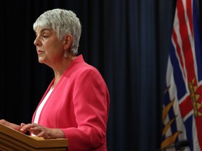 Finance Minister Carole James releases the provincial public accounts report during a press conference at the press gallery at B.C. Legislature in Victoria, Thursday, July 18, 2019. The impact of the COVID-19 pandemic has turned British Columbia's budget forecast from black to red.