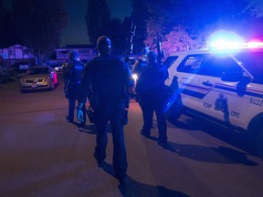 Members of the RCMP are seen after investigating a home where a caller had thought they had heard a gun shot in Surrey, B.C., Friday, May 31, 2019. The first-ever police board meeting for Surrey, B.C., will be held today as the city moves ahead with a controversial plan to replace the local RCMP detachment with its own police service.